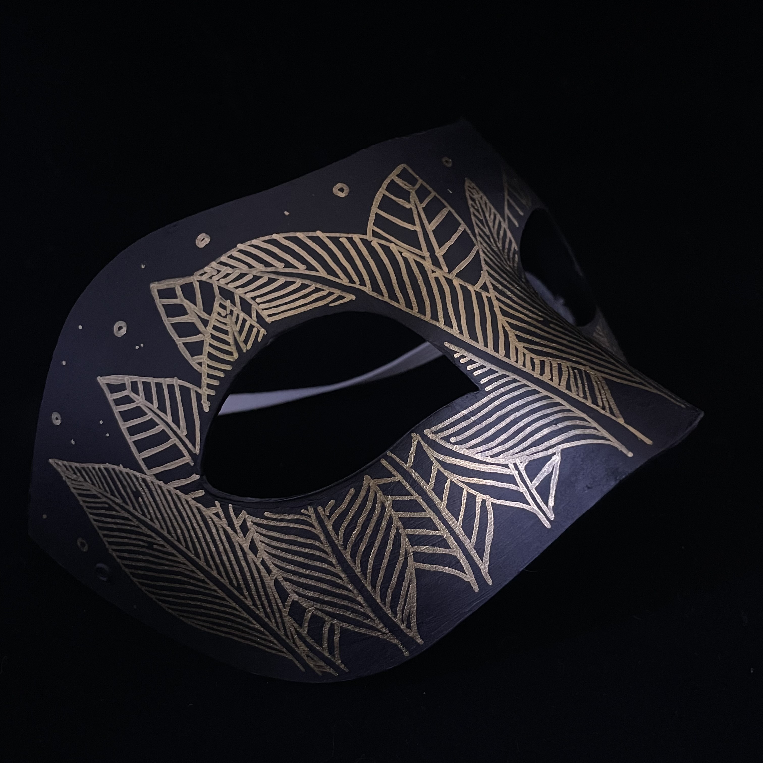 mask with feather pattern