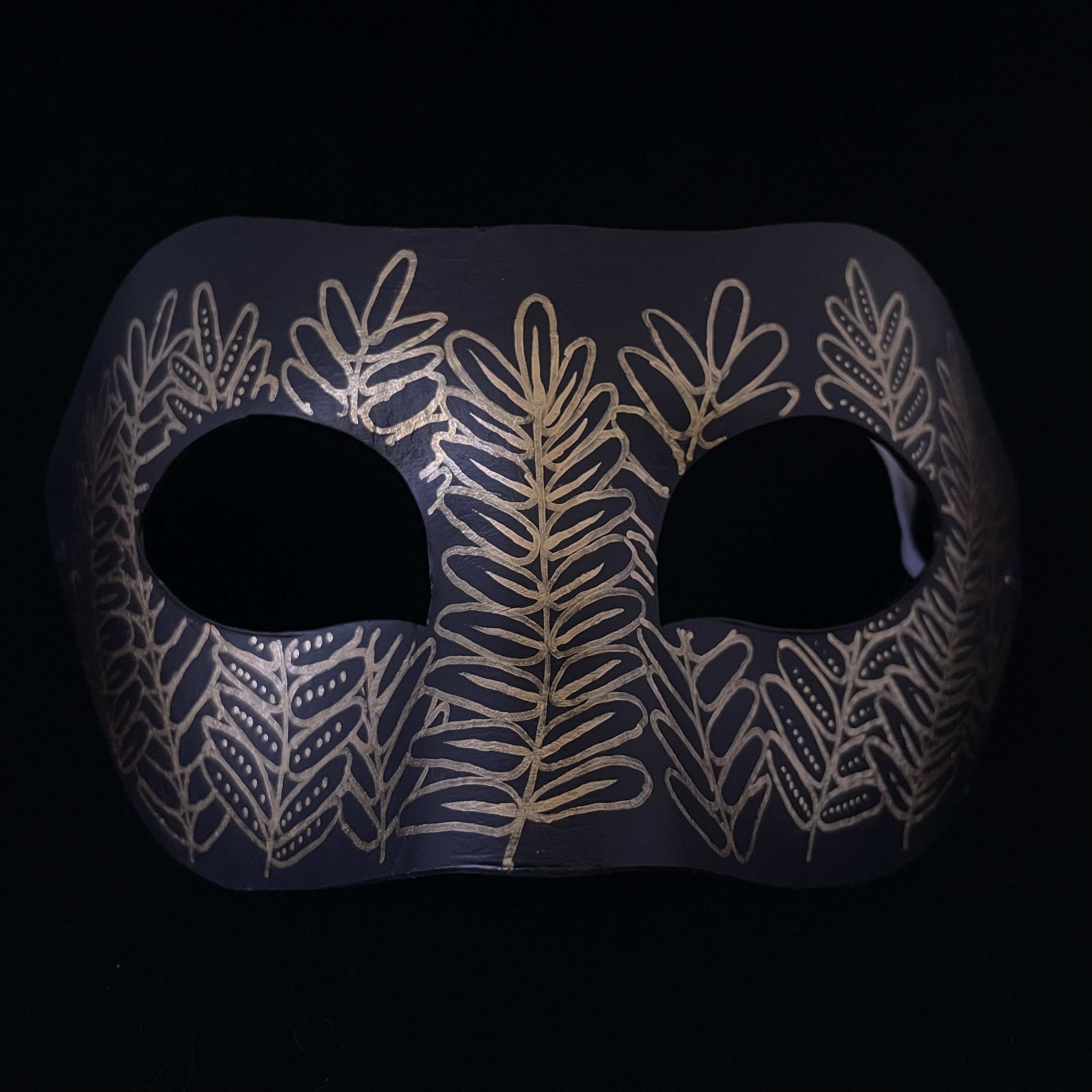 mask with fern leaf pattern
