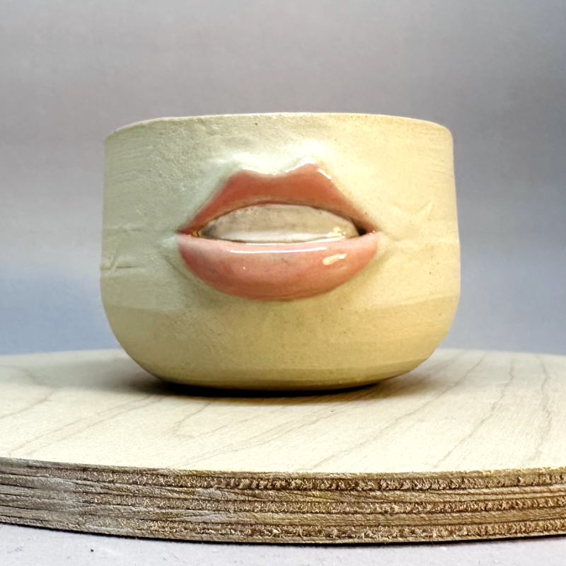 A square-shaped vessel with a face